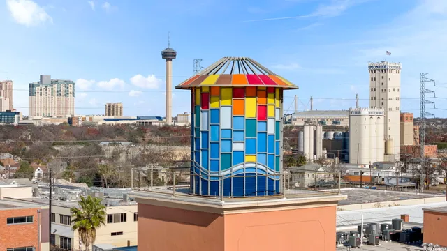 an aerial view of a building with an outdoor space