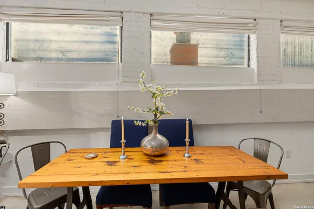 a living room with furniture gym equipment and a window