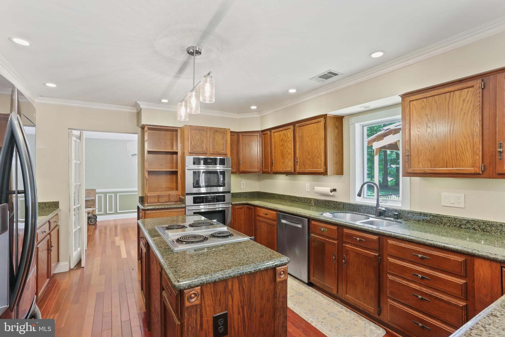 12803 Molly Berry Road Upper Marlboro, MD 20772 - Photo 11 of 61 a kitchen with stainless steel appliances granite countertop a sink stove and refrigerator