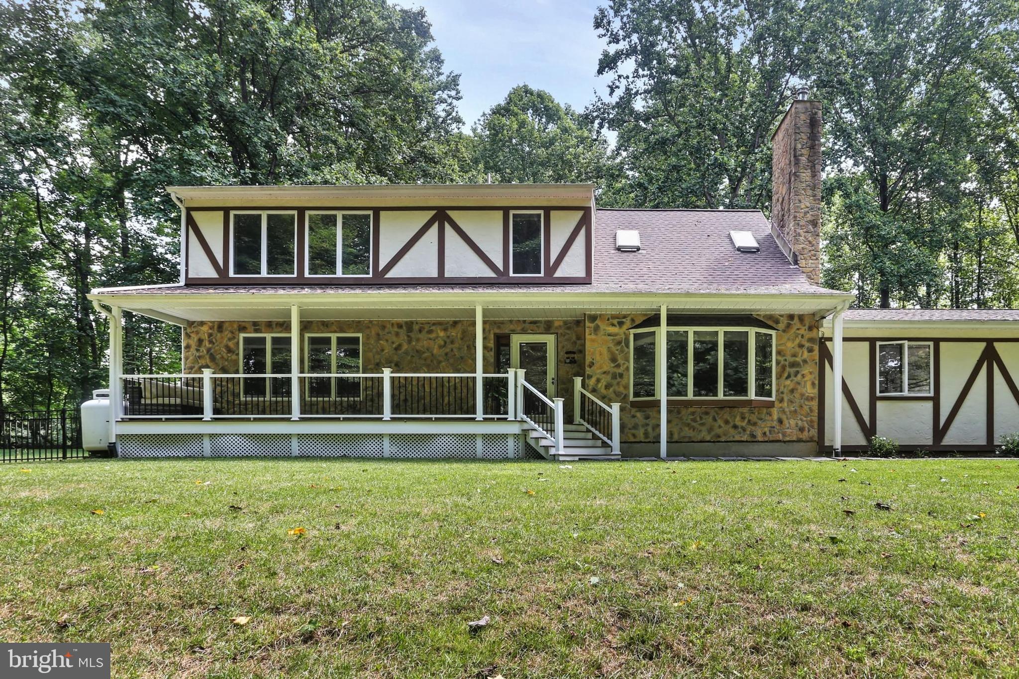 12803 Molly Berry Road Upper Marlboro, MD 20772 - Photo 2 of 61 a front view of a house with garden