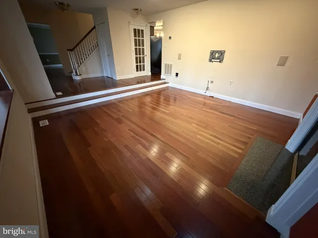 a view of living room with furniture and a fireplace