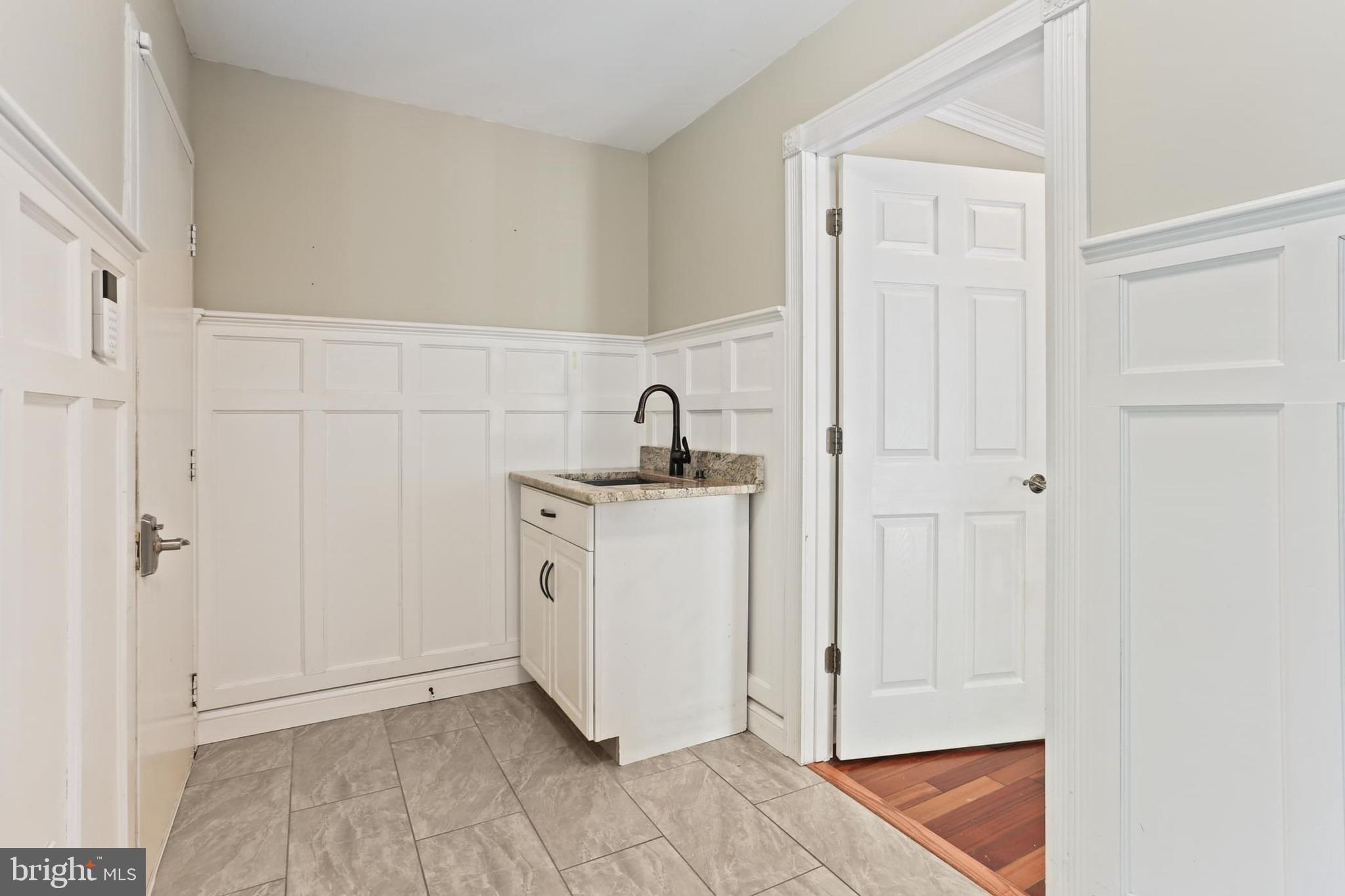 12803 Molly Berry Road Upper Marlboro, MD 20772 - Photo 27 of 61 a bathroom with a sink and a mirror