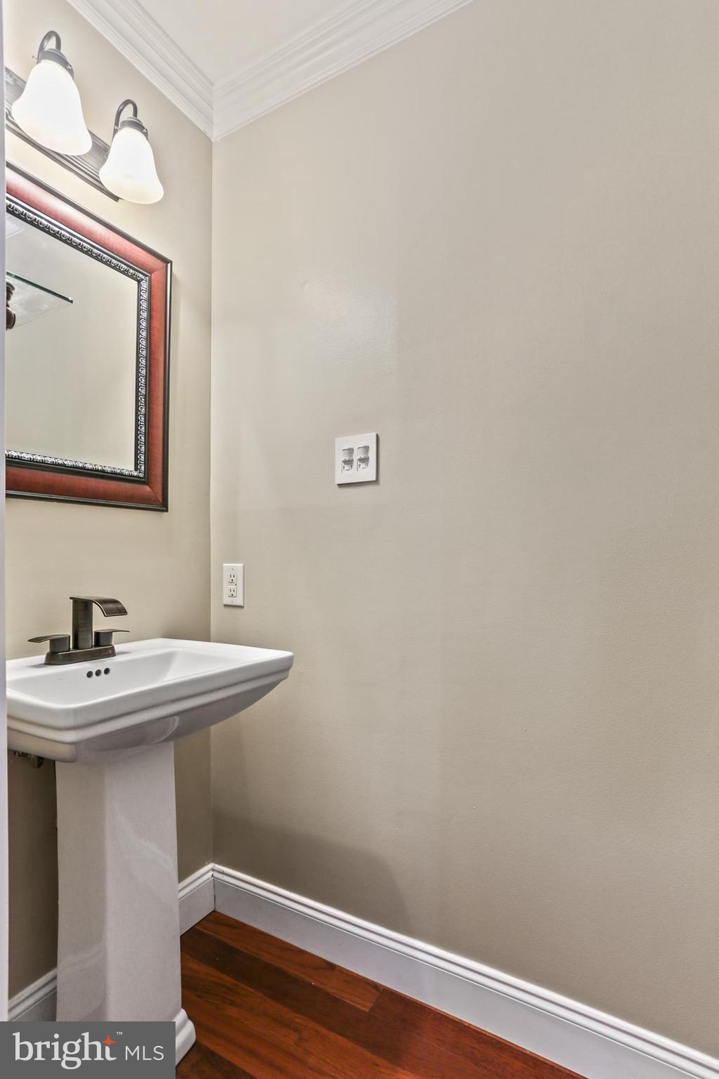 12803 Molly Berry Road Upper Marlboro, MD 20772 - Photo 28 of 61 a bathroom with a sink and a mirror