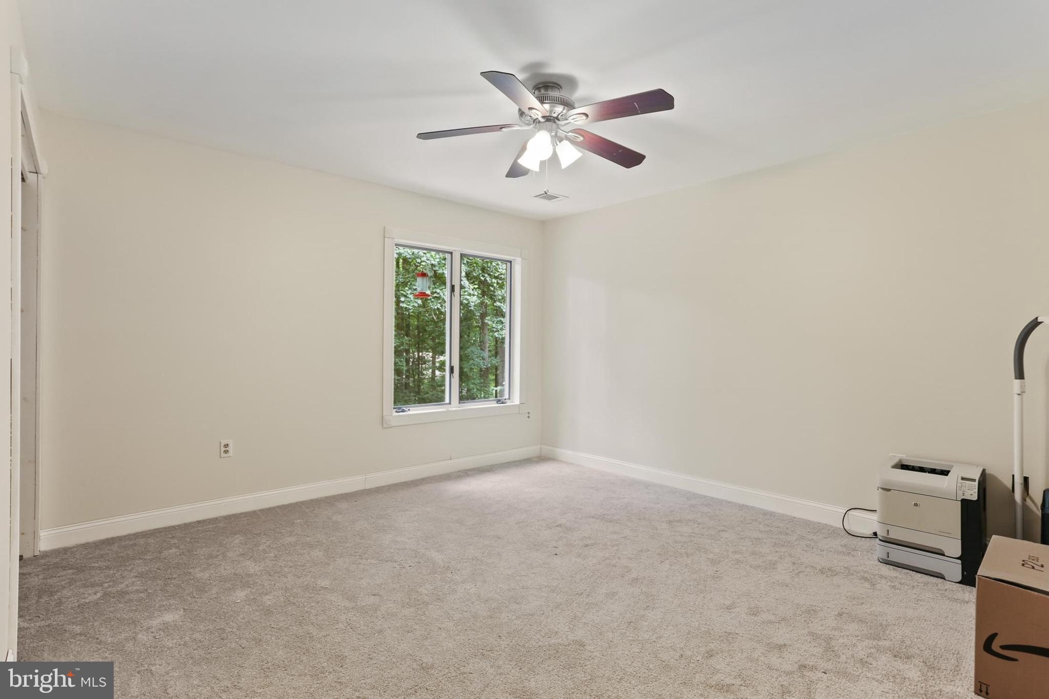 12803 Molly Berry Road Upper Marlboro, MD 20772 - Photo 40 of 61 an empty room with ceiling fan and window