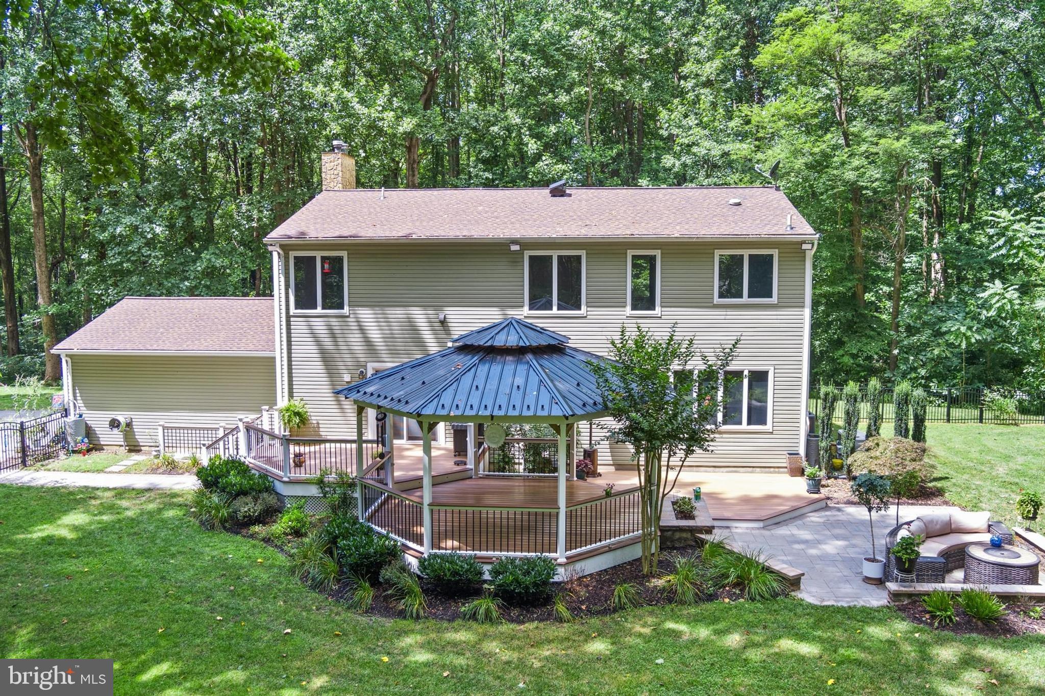 12803 Molly Berry Road Upper Marlboro, MD 20772 - Photo 54 of 61 a front view of a house with garden