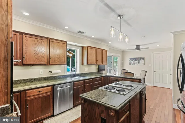 a kitchen with a stove and a sink
