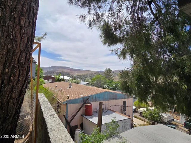 a view of a backyard with sitting area
