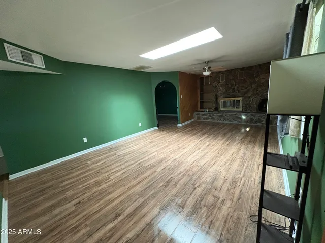 a view of a livingroom with wooden floor