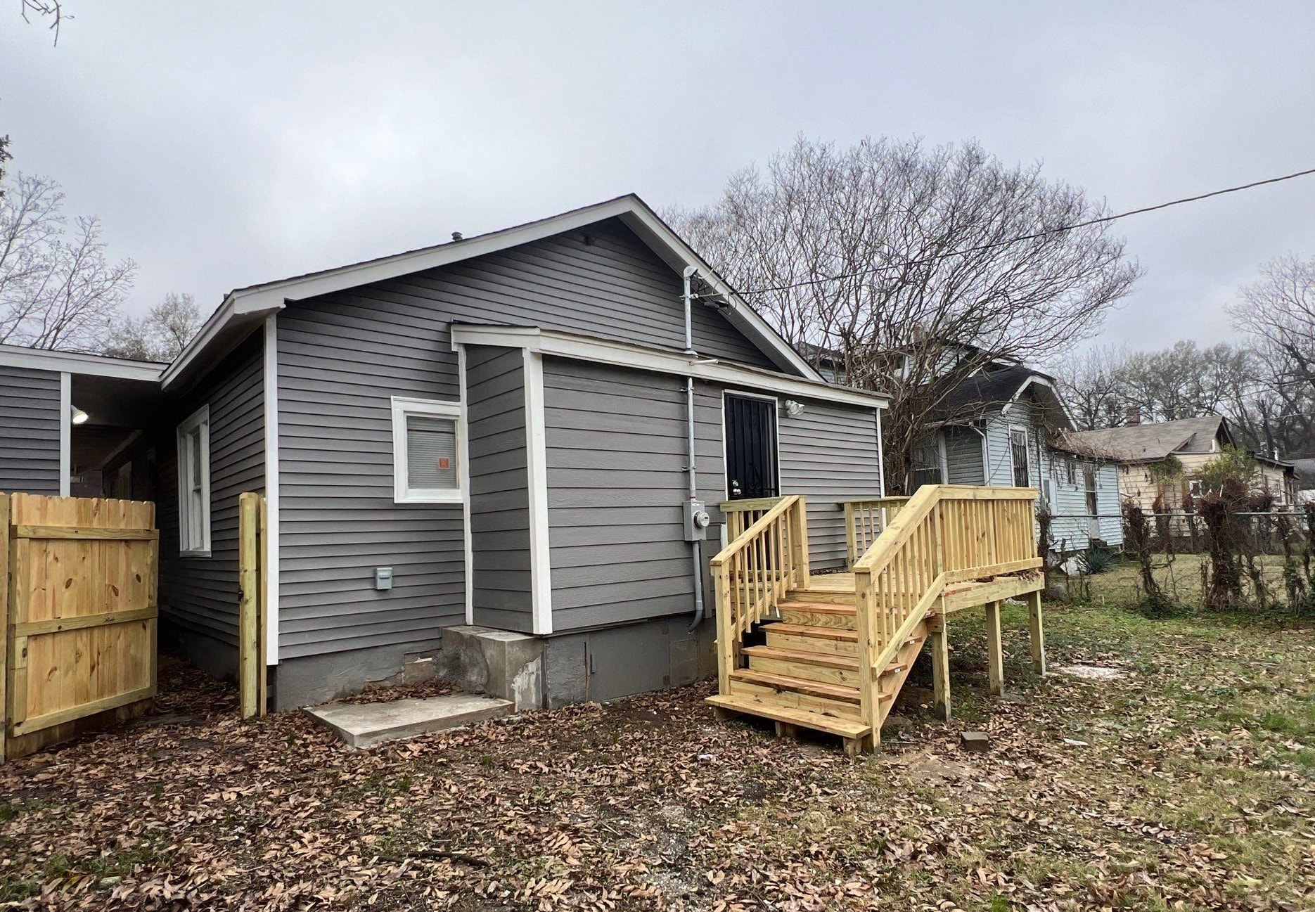 2974 Waverly Avenue Memphis, TN 38111 - Photo 13 of 13 a view of a house with a yard chairs and wooden fence