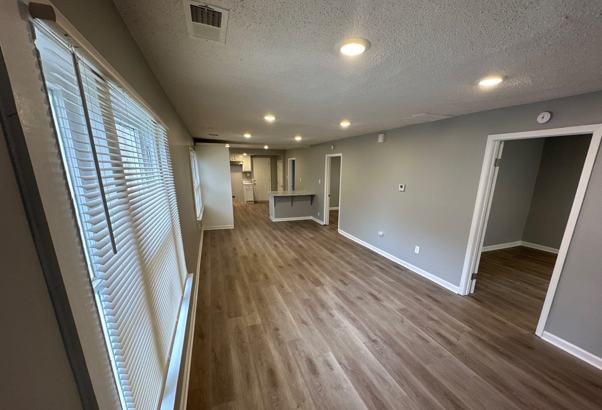 2974 Waverly Avenue Memphis, TN 38111 - Photo 5 of 13 an entryway in a hall with wooden floor
