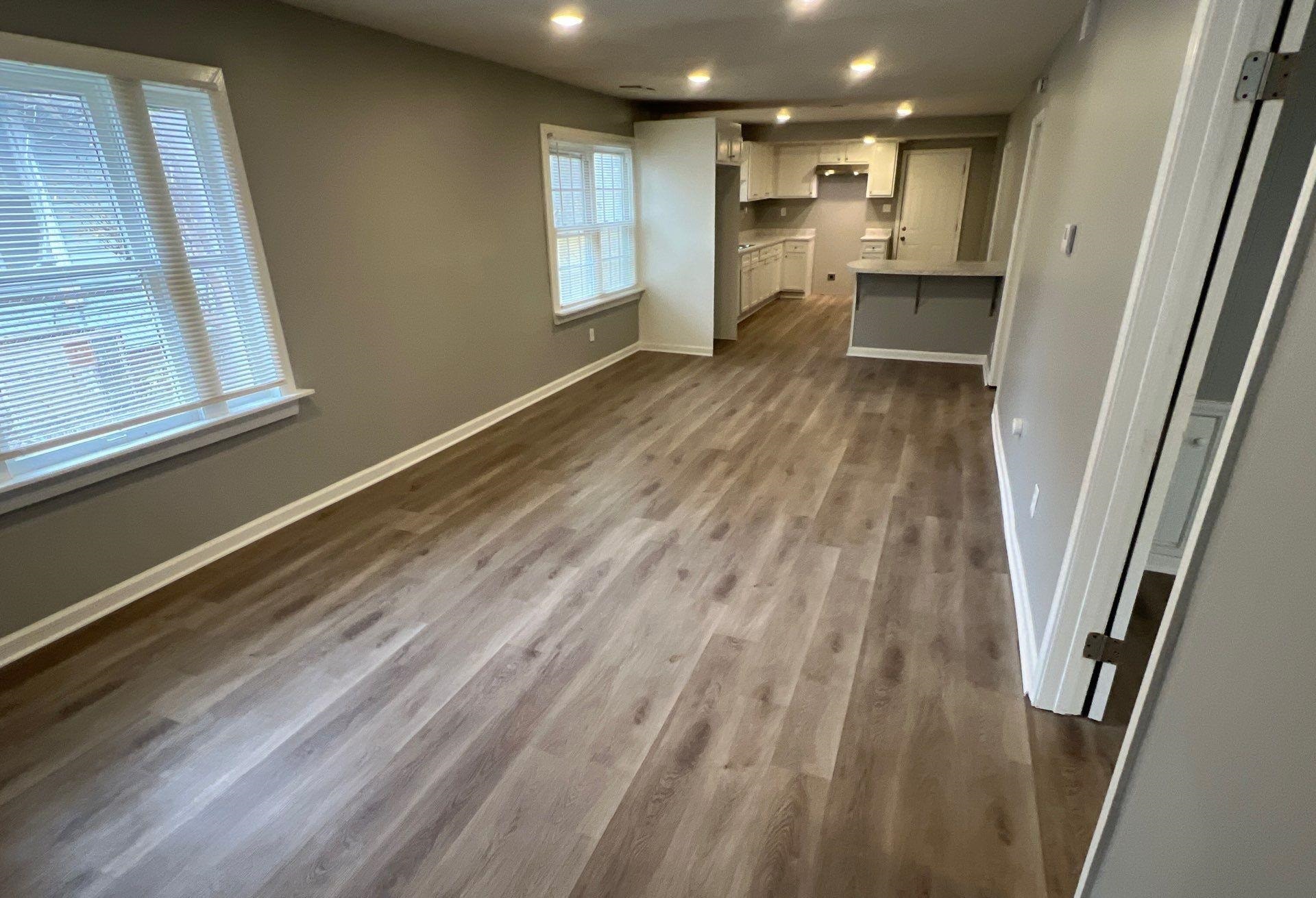 2974 Waverly Avenue Memphis, TN 38111 - Photo 7 of 13 a view of empty room with wooden floor and window