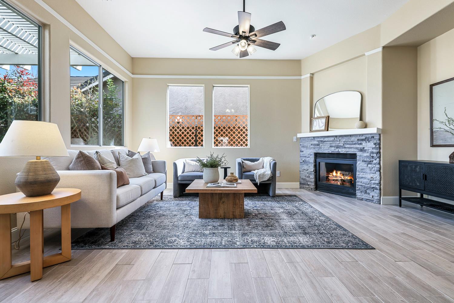 2735 Swift Avenue Clovis, CA 93611 - Photo 2 of 30 a living room with furniture and a fireplace