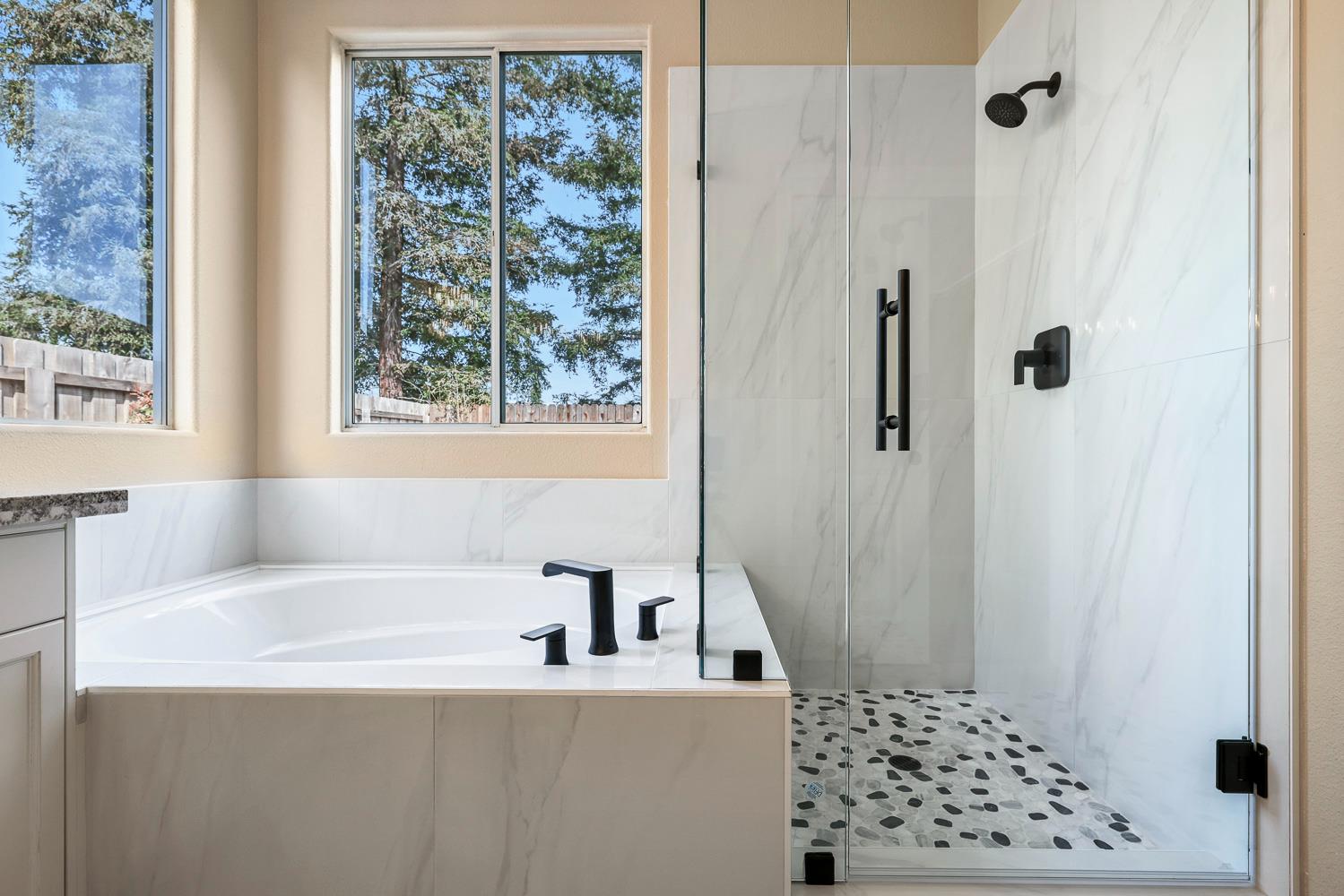 2735 Swift Avenue Clovis, CA 93611 - Photo 21 of 30 a bathroom with a bathtub and shower
