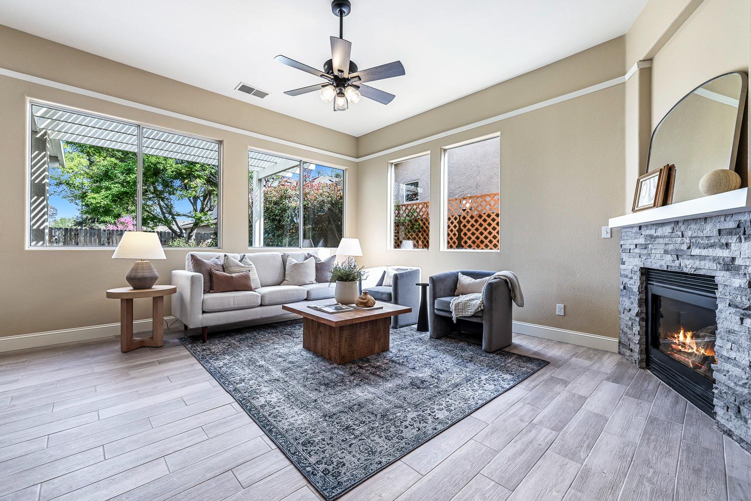 2735 Swift Avenue Clovis, CA 93611 - Photo 3 of 30 a living room with furniture and a fireplace