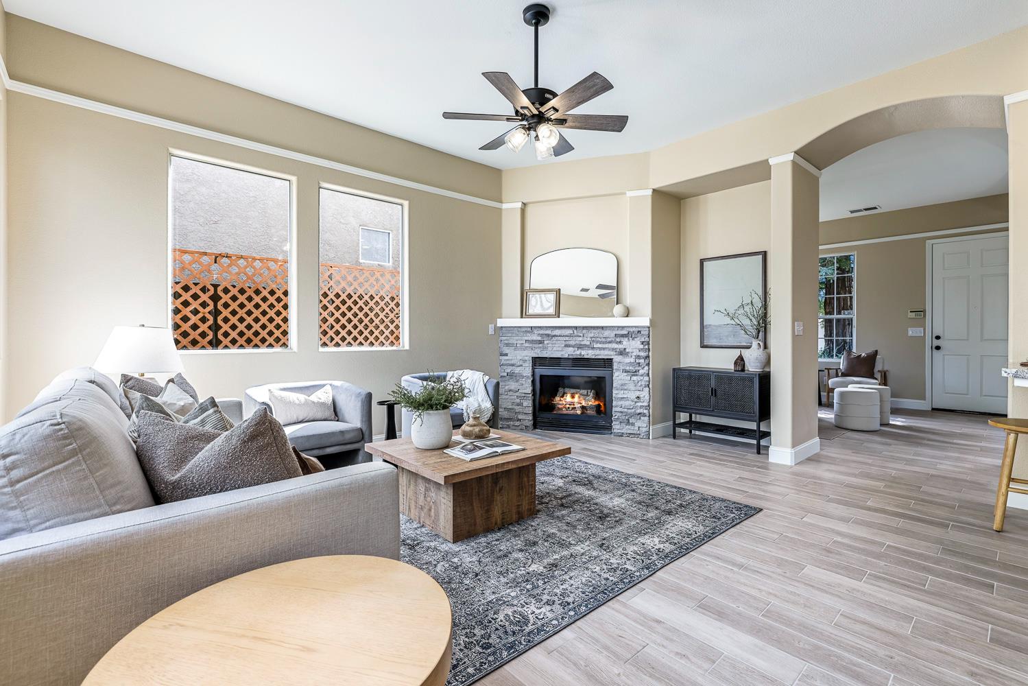 2735 Swift Avenue Clovis, CA 93611 - Photo 4 of 30 a living room with furniture a fireplace and a table