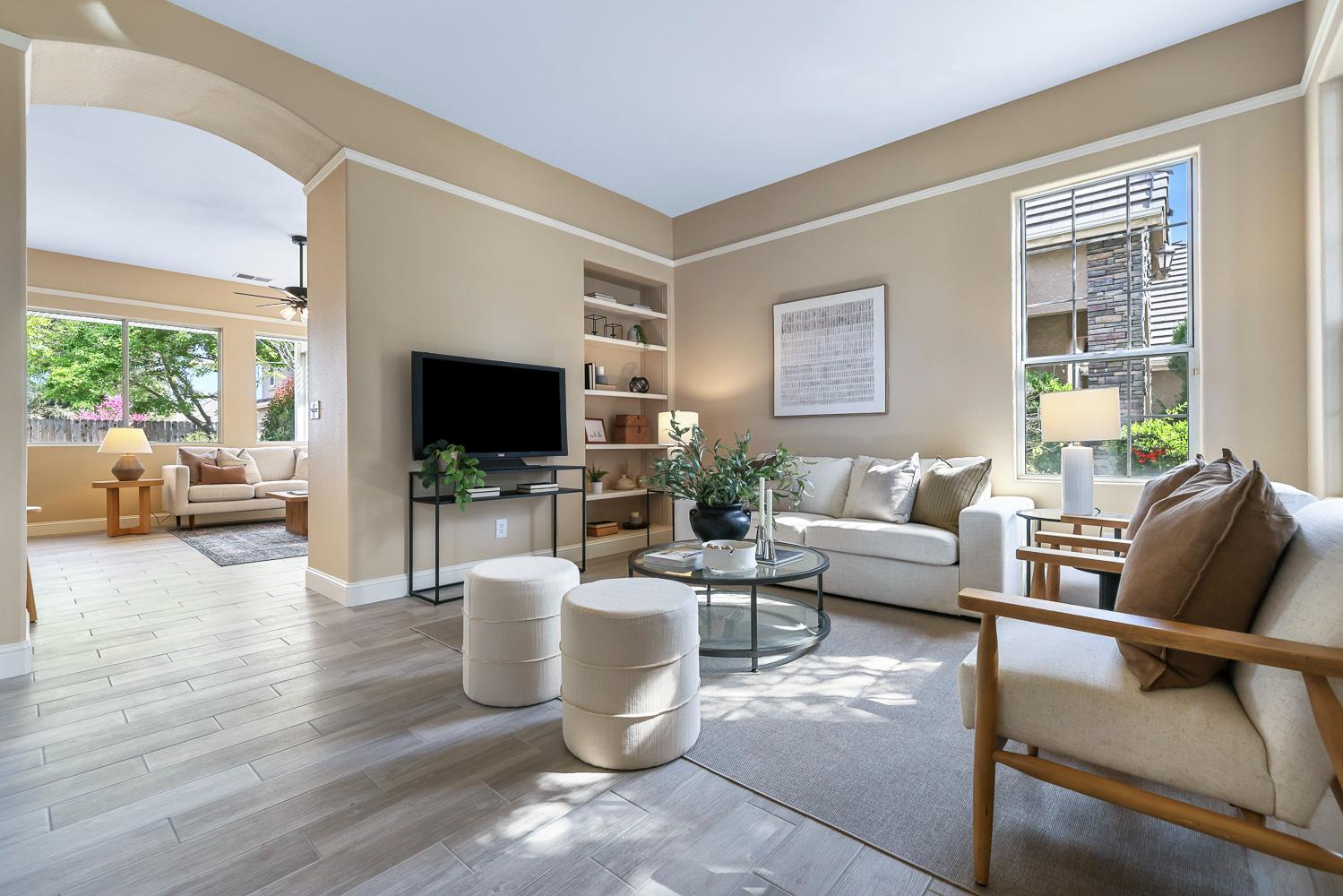 2735 Swift Avenue Clovis, CA 93611 - Photo 6 of 30 a living room with furniture a flat screen tv and a large window