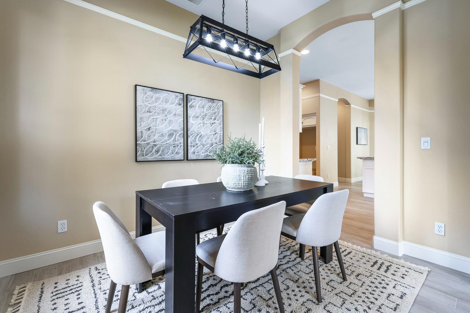 2735 Swift Avenue Clovis, CA 93611 - Photo 8 of 30 a view of a dining room with furniture and chandelier