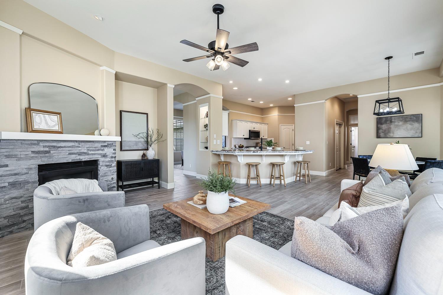 2735 Swift Avenue Clovis, CA 93611 - Photo 9 of 30 a living room with furniture and a chandelier