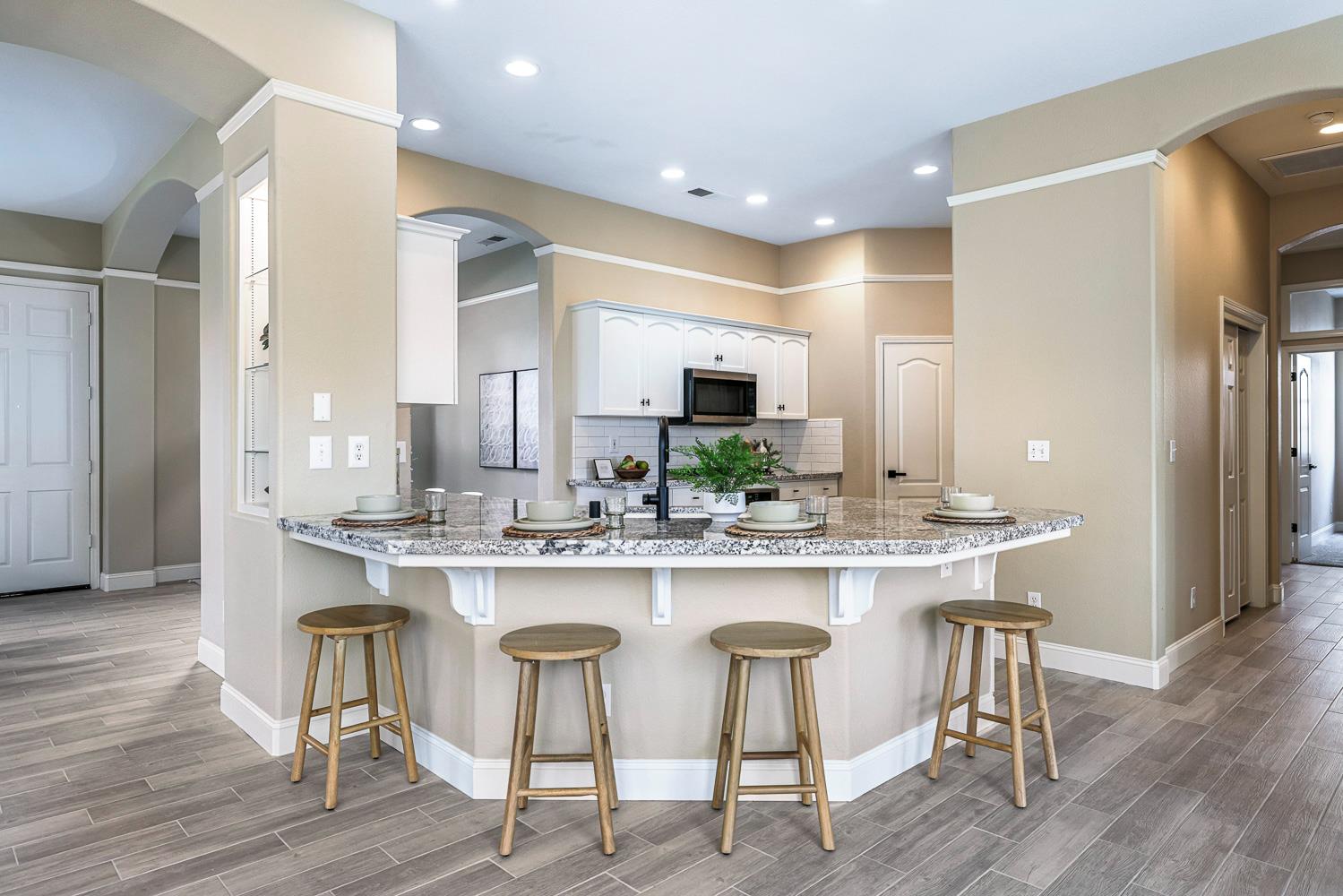 2735 Swift Avenue Clovis, CA 93611 - Photo 10 of 30 a kitchen with a table and chairs in it