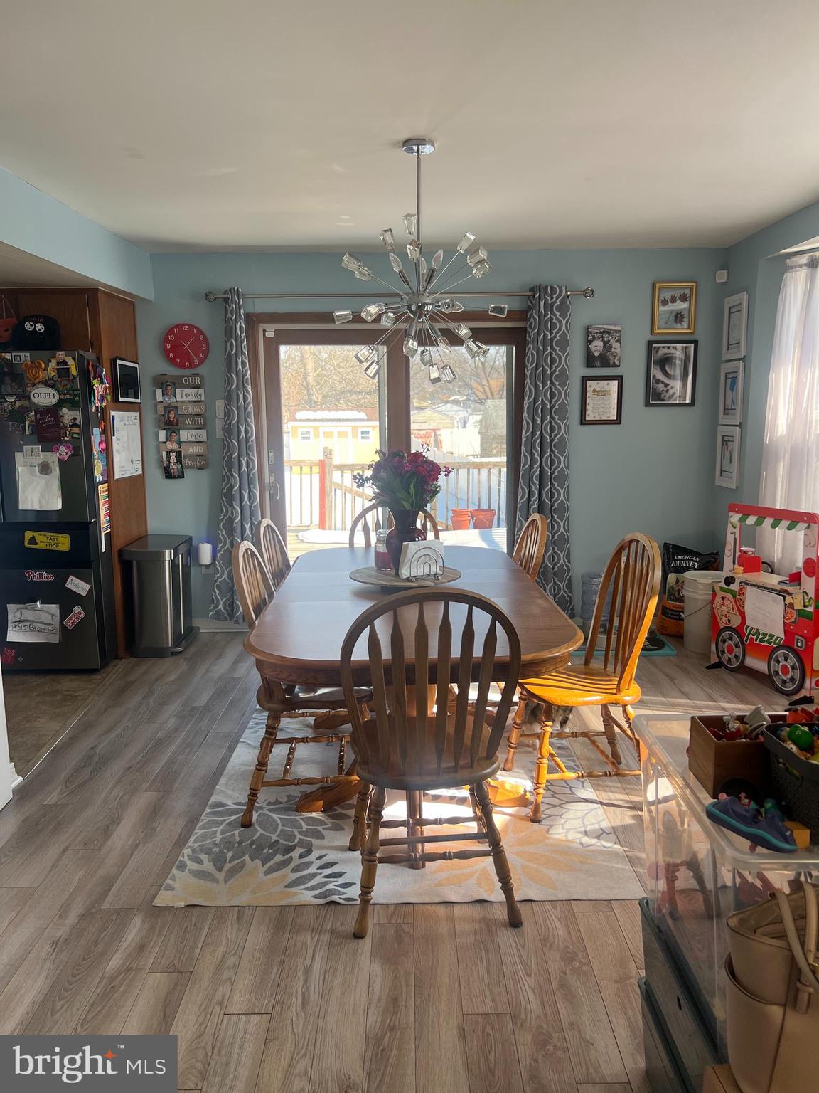 47 South Lippincott Avenue Maple Shade, NJ 08052 - Photo 15 of 24 a dining room with furniture a chandelier and wooden floor