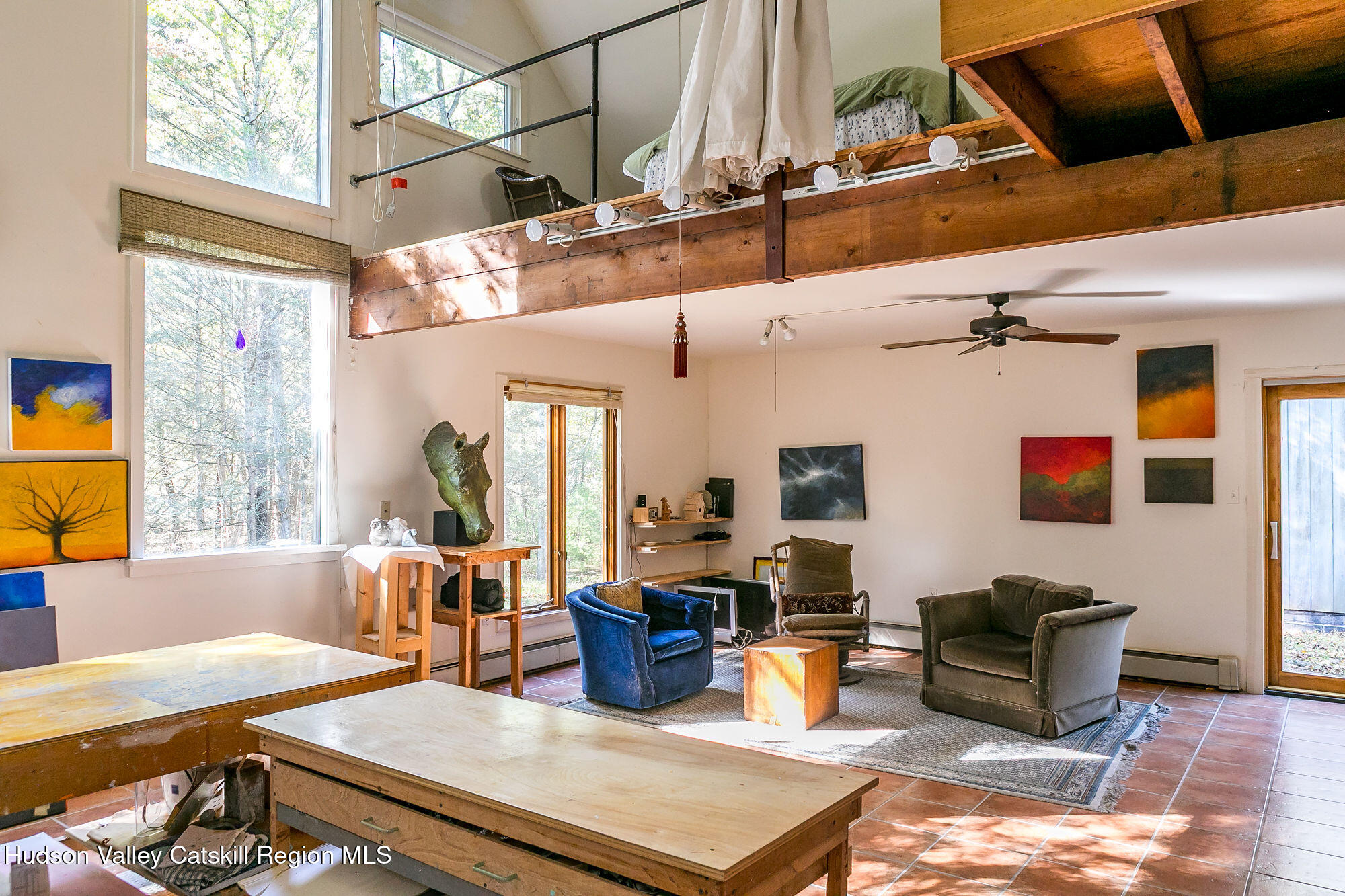 60 Phillips Road Saugerties, NY 12477 - Photo 12 of 23 a living room with furniture a flat screen tv and a table