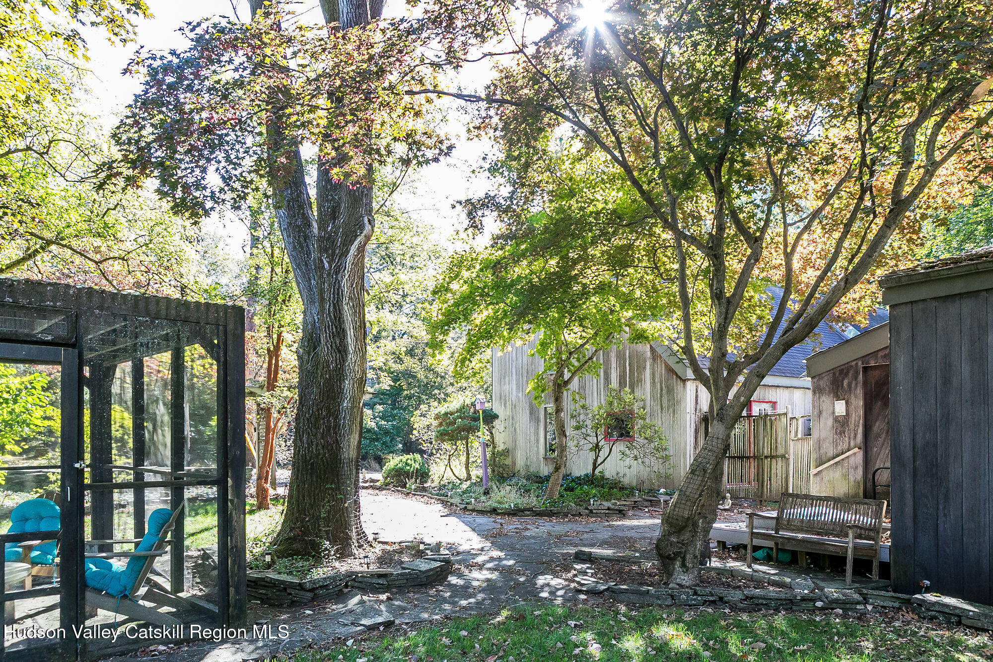 60 Phillips Road Saugerties, NY 12477 - Photo 17 of 23 a view of a house with a tree in the forest