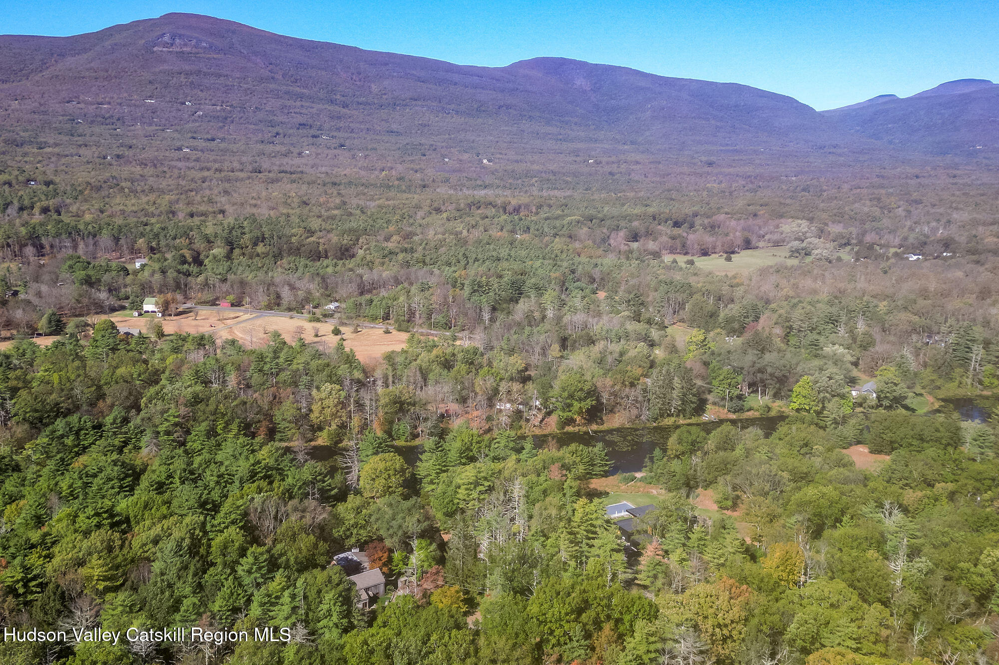 60 Phillips Road Saugerties, NY 12477 - Photo 22 of 23 a view of a lush green hillside and a houses