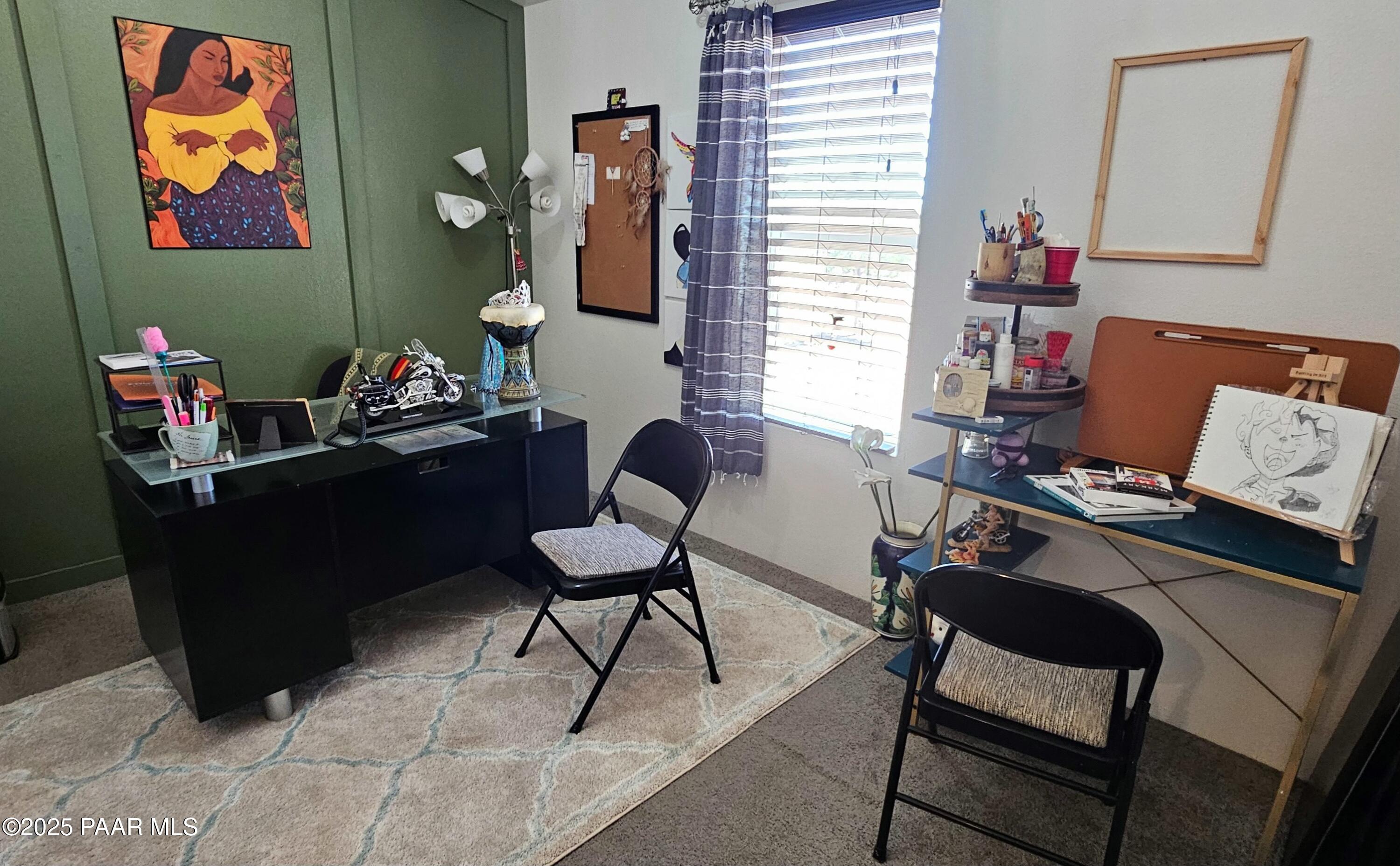 8850 West Fountain Ranch Road Ash Fork, AZ 86320 - Photo 12 of 29 a room with furniture and a window