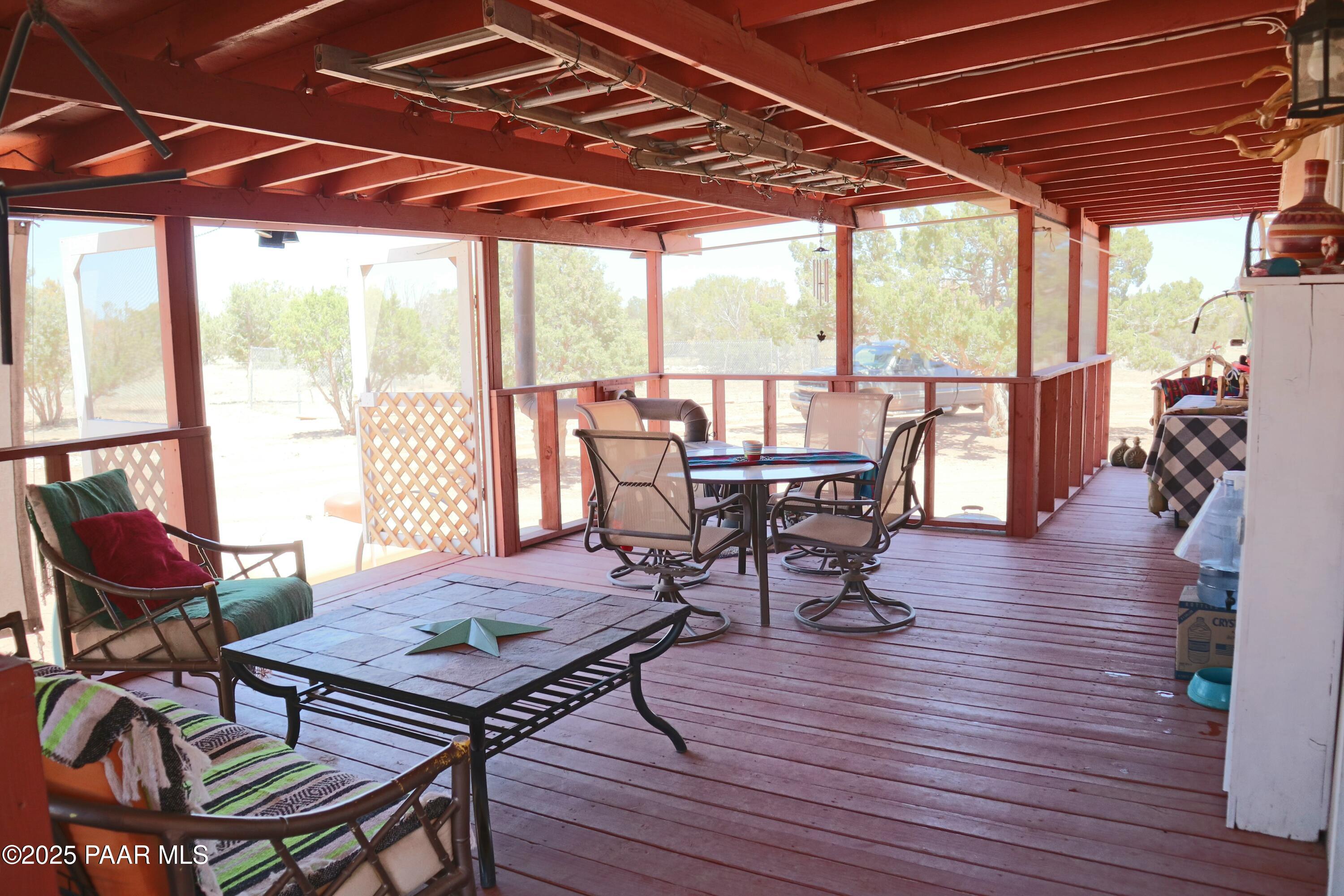 8850 West Fountain Ranch Road Ash Fork, AZ 86320 - Photo 15 of 29 a view of a patio with table and chairs and potted plants