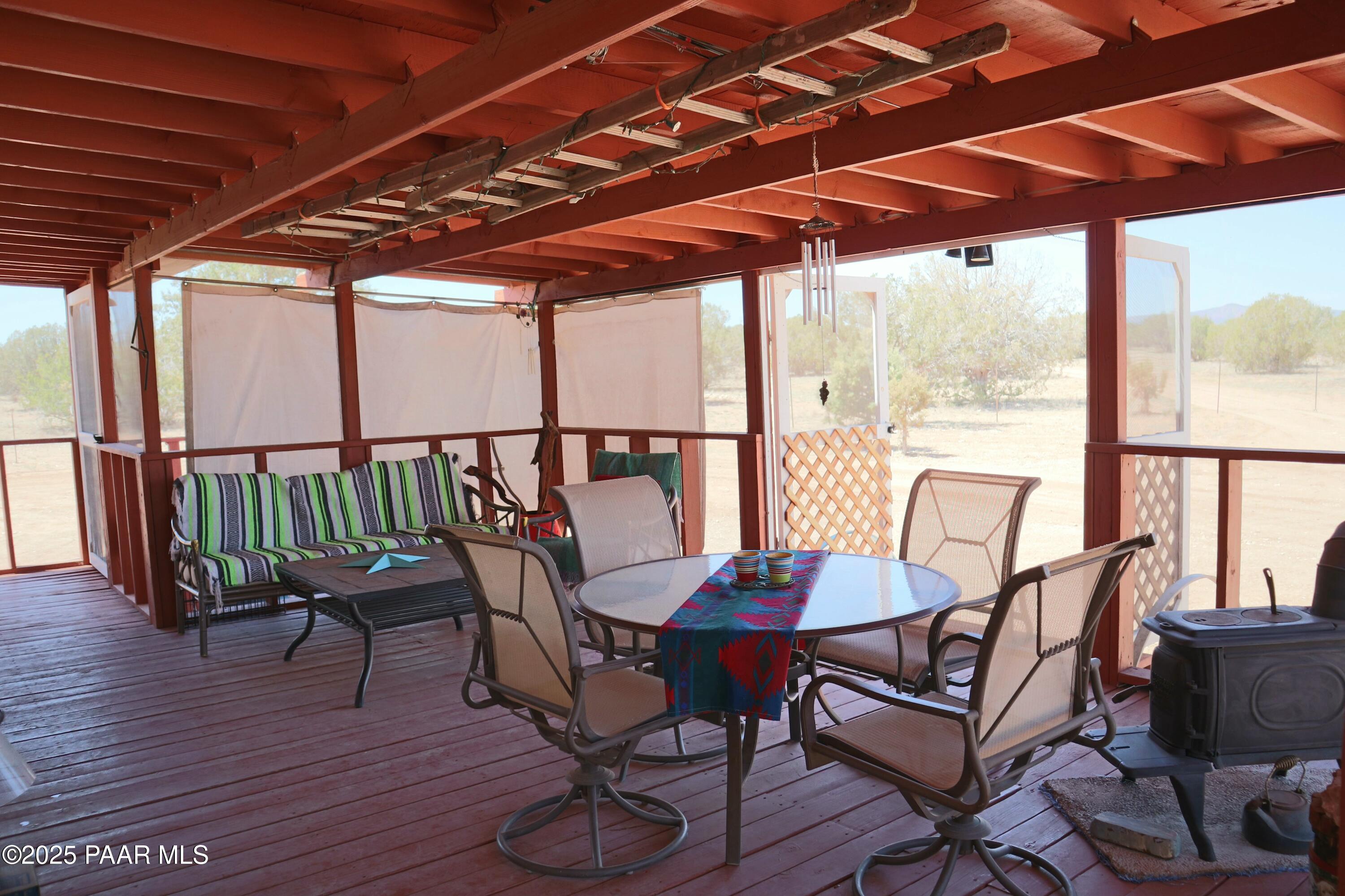 8850 West Fountain Ranch Road Ash Fork, AZ 86320 - Photo 16 of 29 a view of a chairs and table in the patio