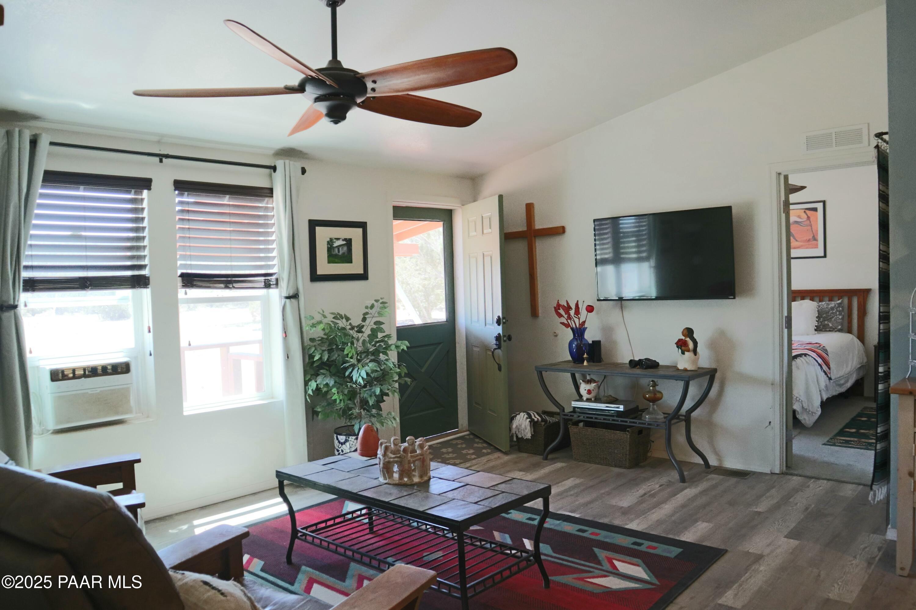 8850 West Fountain Ranch Road Ash Fork, AZ 86320 - Photo 6 of 29 a living room with furniture and a flat screen tv