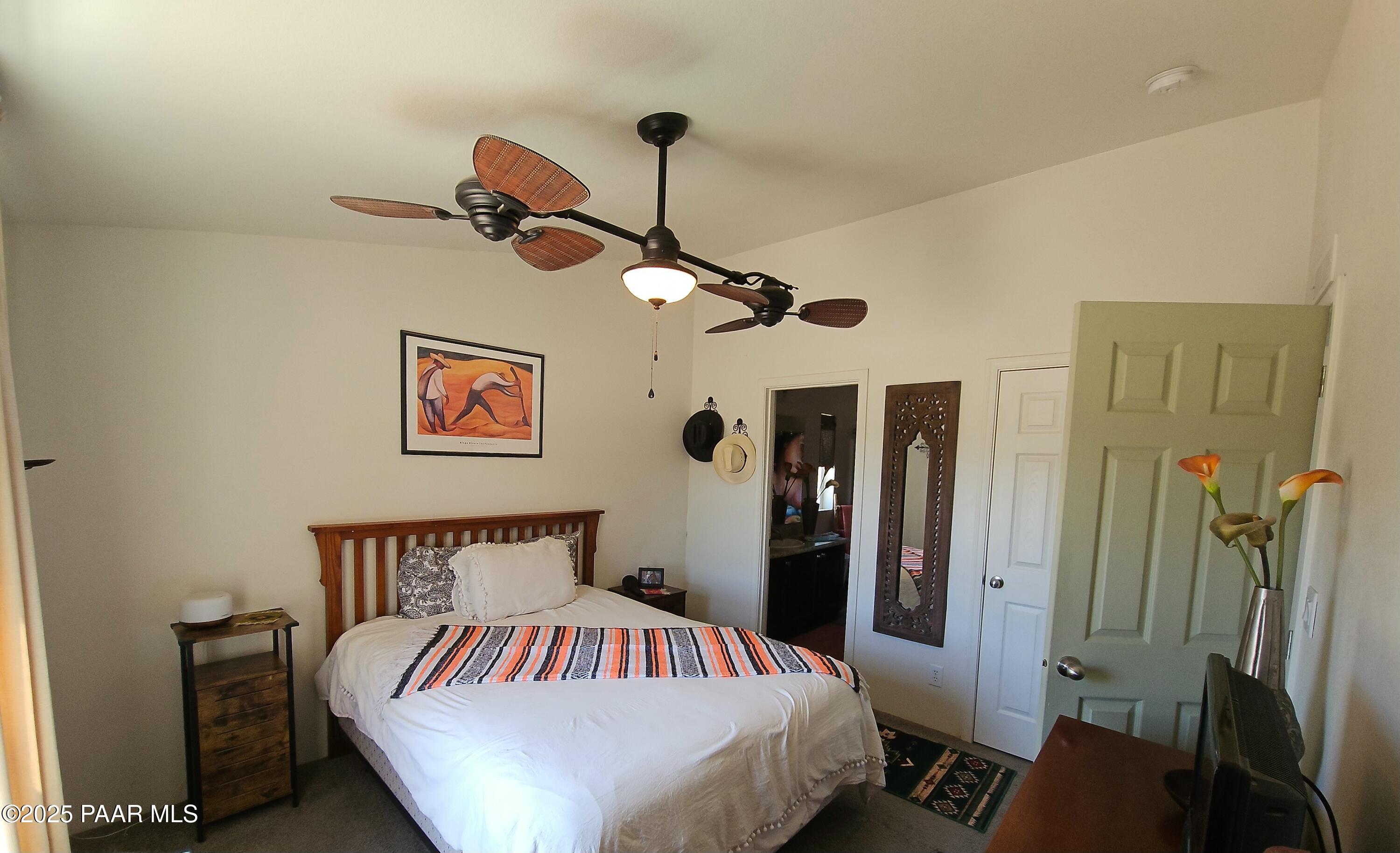 8850 West Fountain Ranch Road Ash Fork, AZ 86320 - Photo 7 of 29 a bedroom with a bed and a mirror