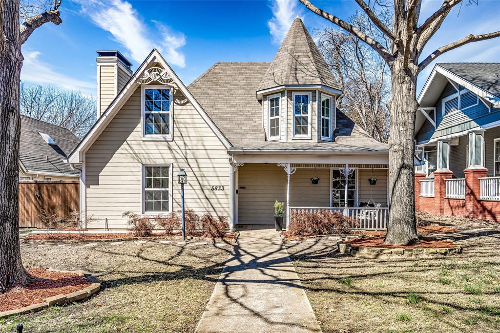a front view of a house with many windows