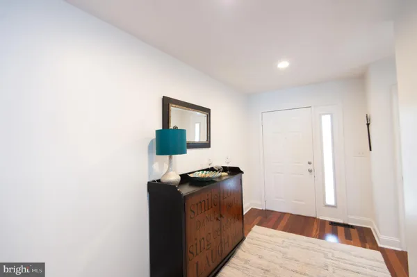 a kitchen with stainless steel appliances granite countertop a refrigerator and a stove