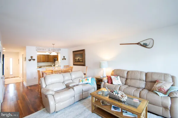 a spacious bathroom with a granite countertop sink and a mirror