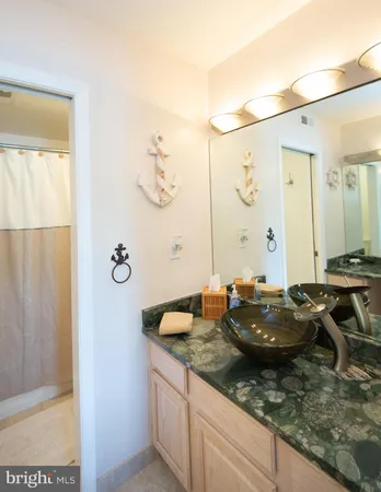 a bedroom with a bed and a ceiling fan