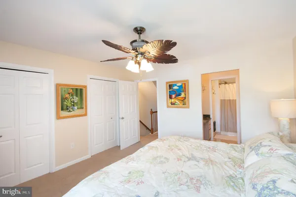 an aerial view of house with yard lake and outdoor seating