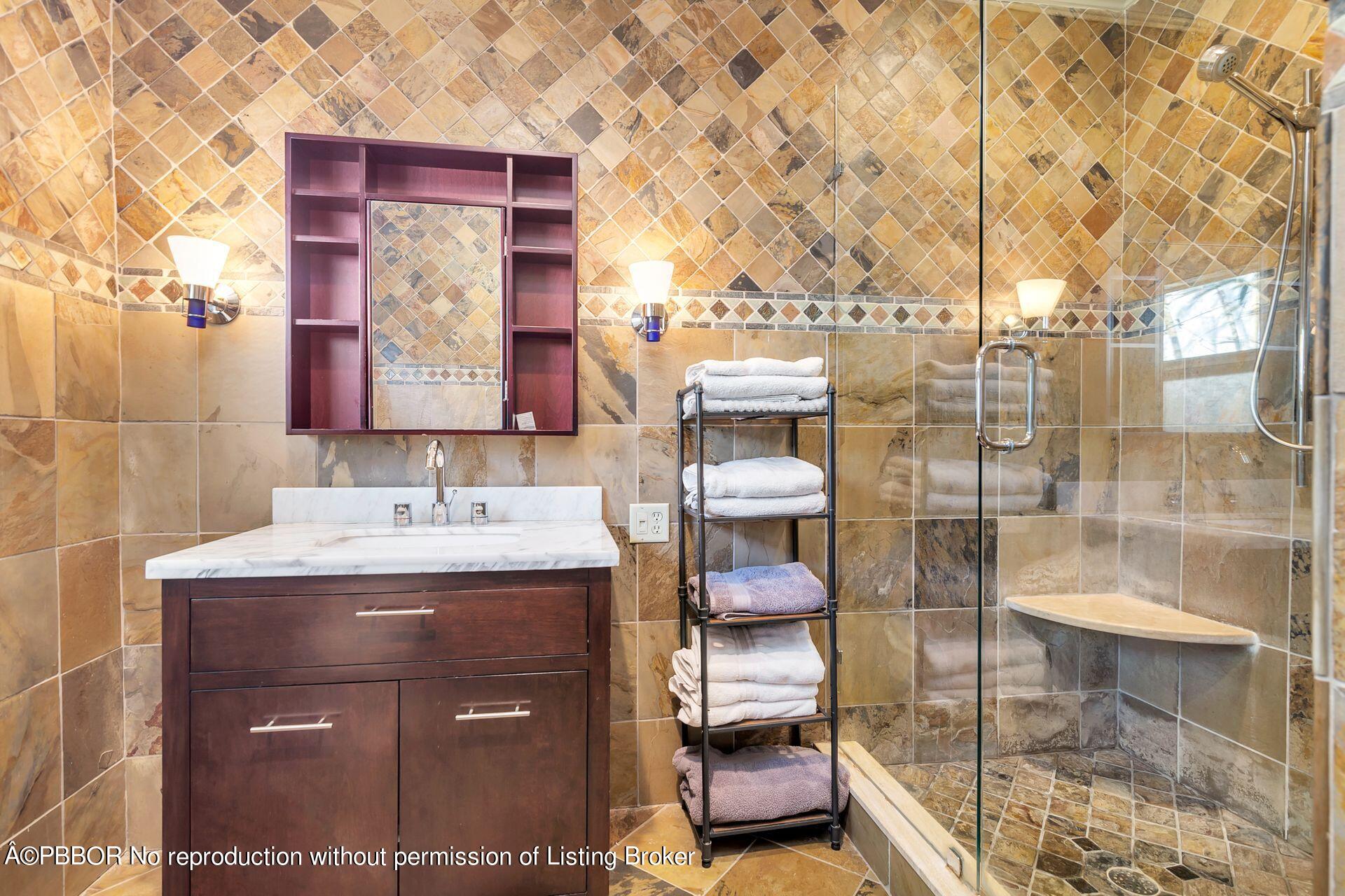 612 Upland Road West Palm Beach, FL 33401 - Photo 12 of 24 a bathroom with a sink and a mirror
