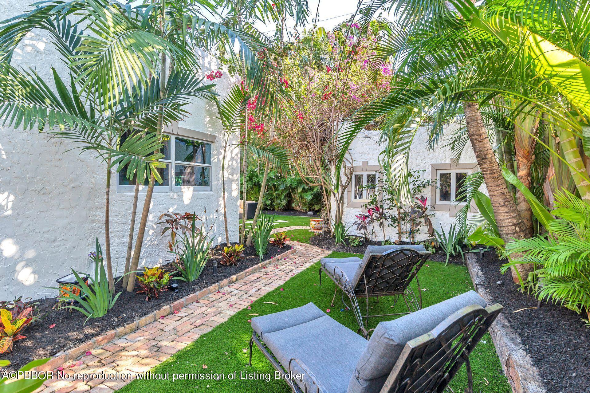 612 Upland Road West Palm Beach, FL 33401 - Photo 15 of 24 a view of a backyard with plants and a garden