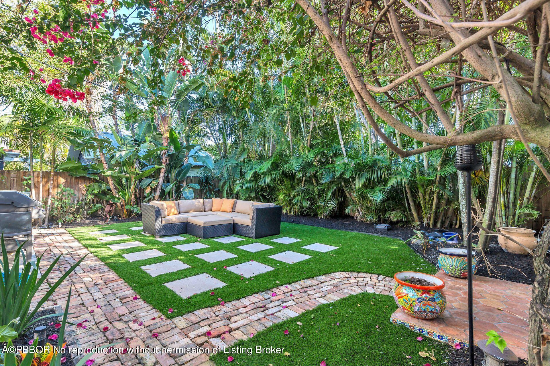 612 Upland Road West Palm Beach, FL 33401 - Photo 16 of 24 a view of a backyard with plants and garden