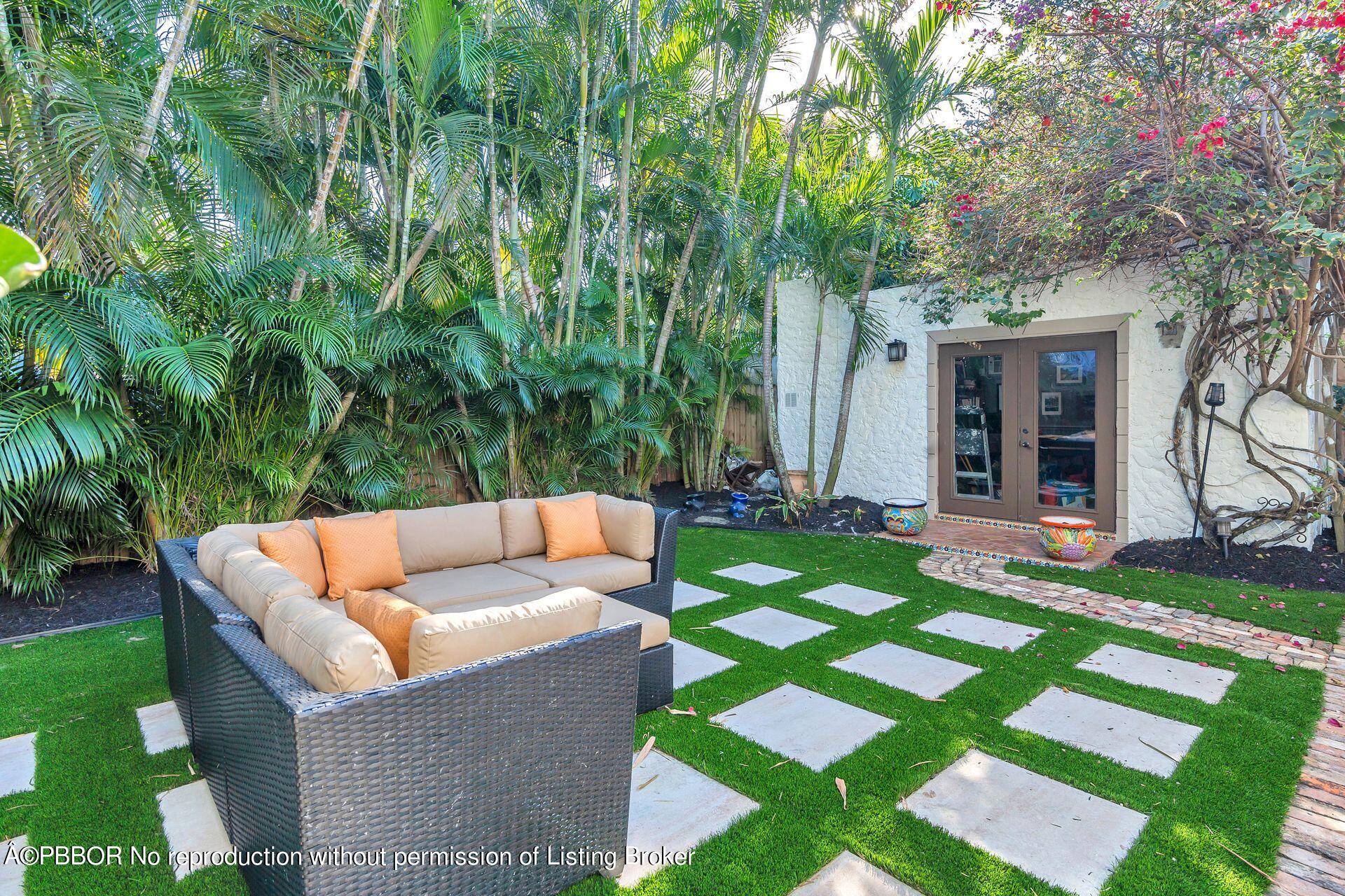 612 Upland Road West Palm Beach, FL 33401 - Photo 17 of 24 a view of house with backyard and outdoor seating