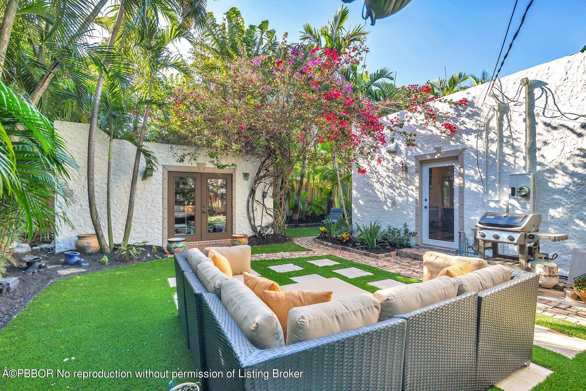 612 Upland Road West Palm Beach, FL 33401 - Photo 18 of 24 a view of a house with backyard and sitting area