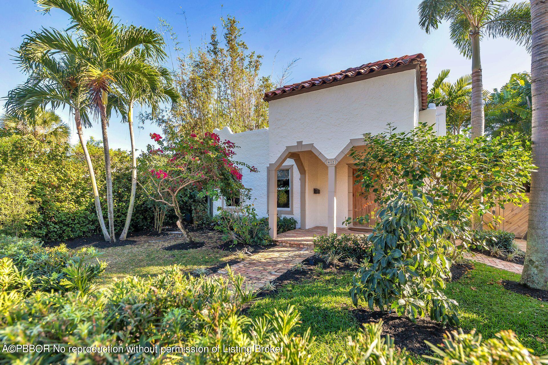 612 Upland Road West Palm Beach, FL 33401 - Photo 19 of 24 a front view of a house with a yard