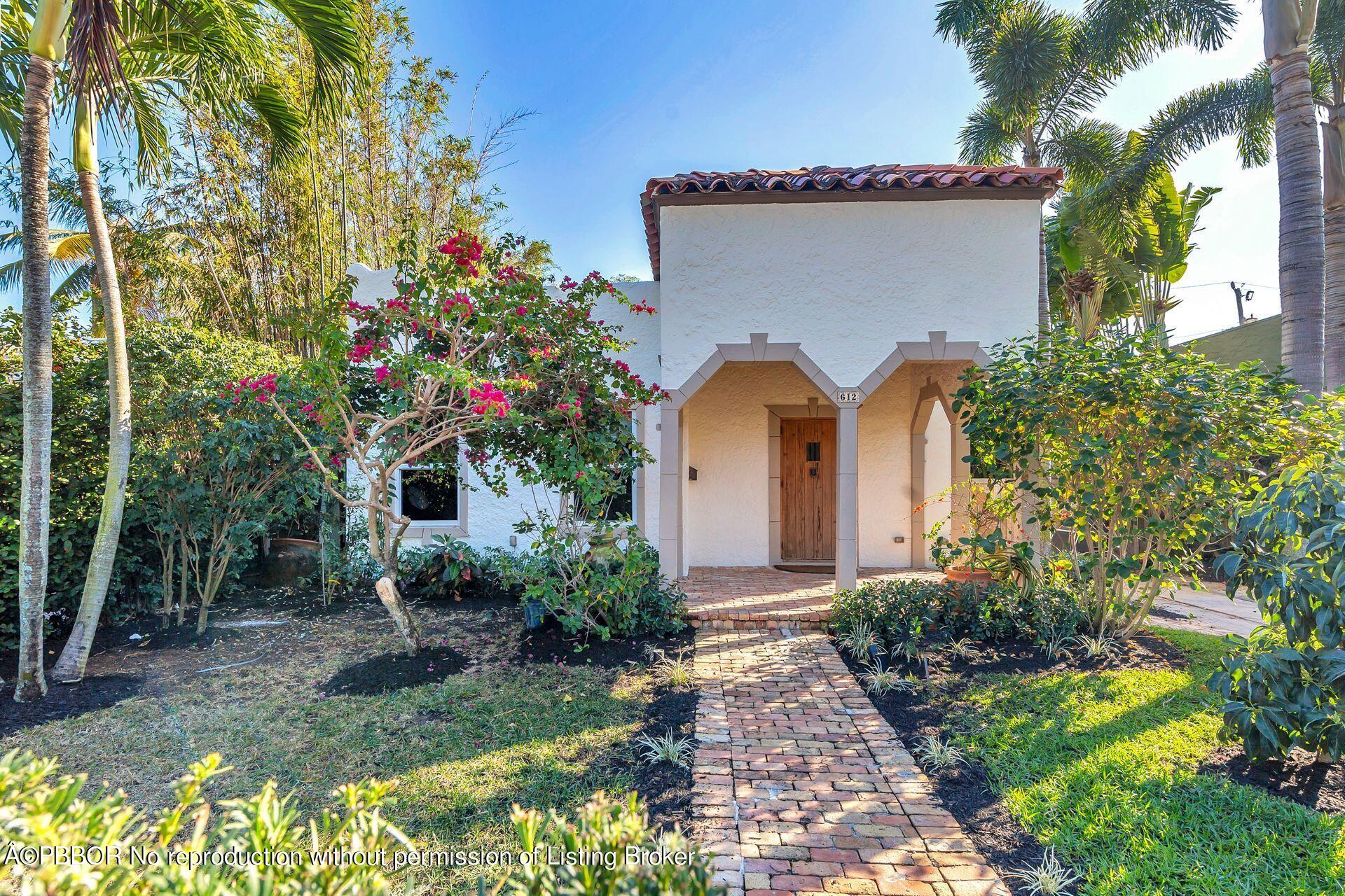 612 Upland Road West Palm Beach, FL 33401 - Photo 20 of 24 a front view of a house with garden