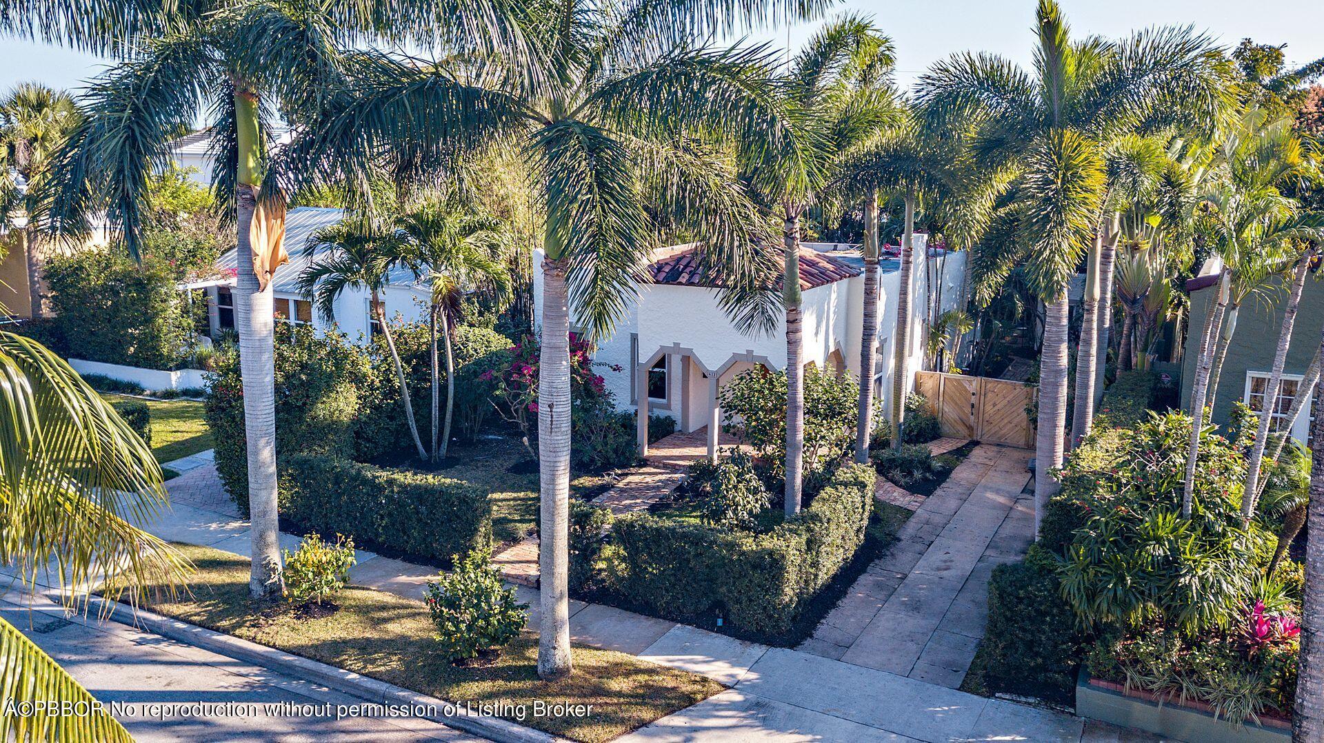 612 Upland Road West Palm Beach, FL 33401 - Photo 22 of 24 a view of backyard with potted plants and palm trees