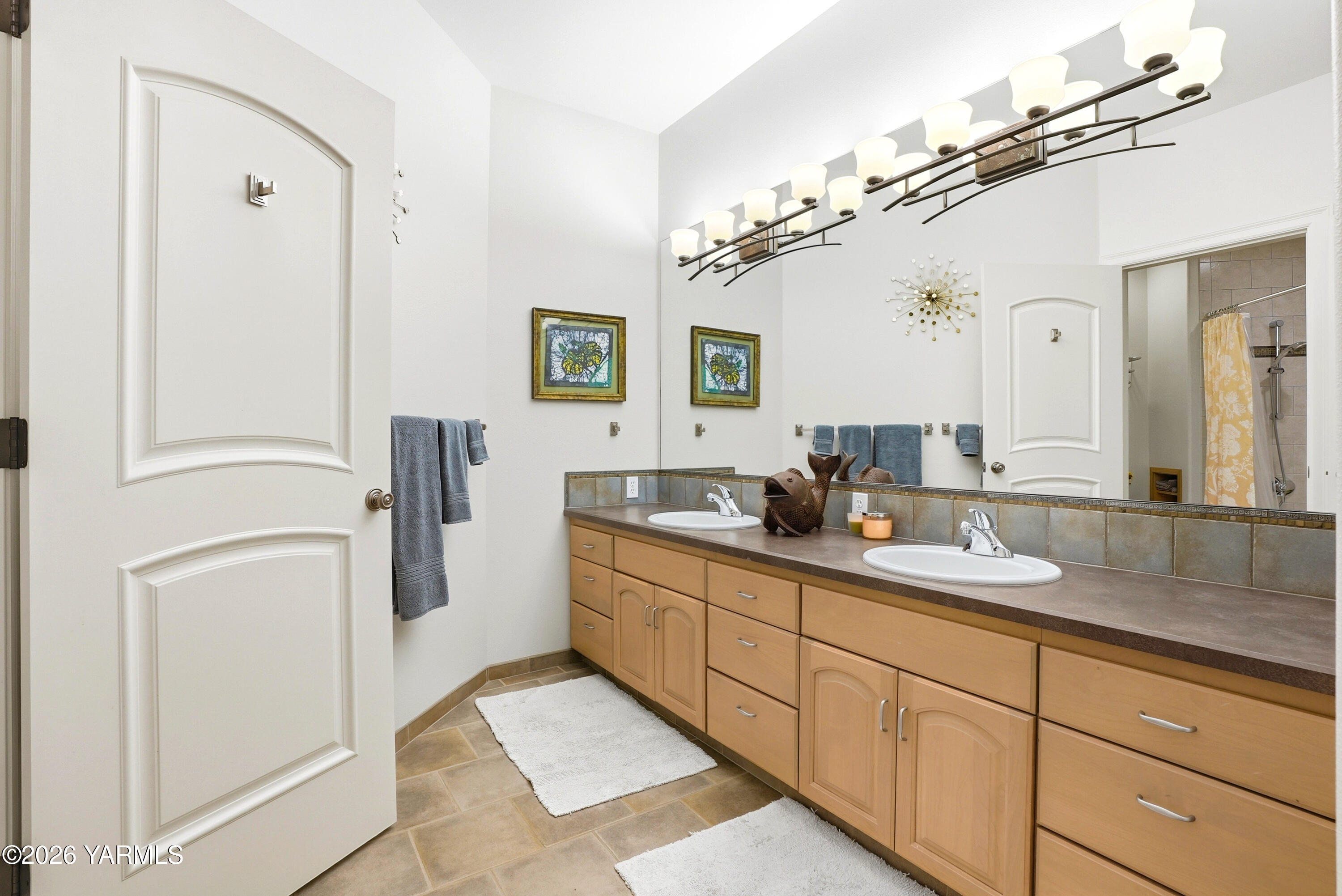 660 Noble Hill Road Yakima, WA 98908 - Photo 41 of 63 a bathroom with double vanity sink a mirror a vanity and a shower