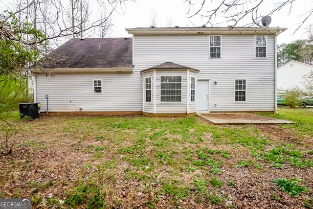 a front view of a house with yard
