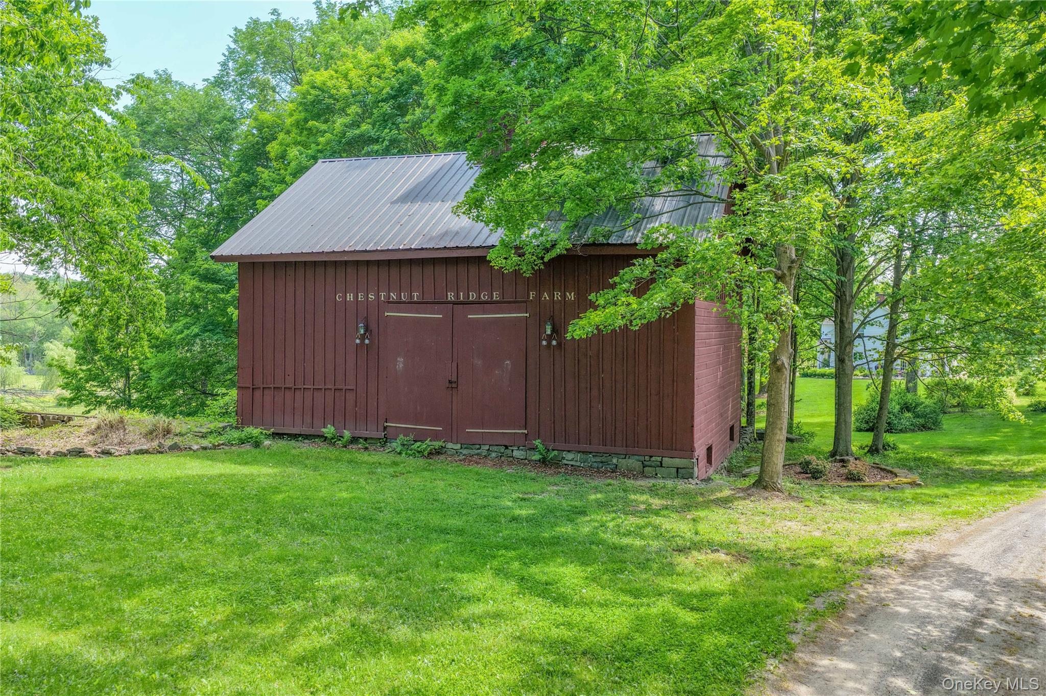 121 Coutant Road Circleville, NY 10919 - Photo 7 of 7 a view of a backyard with barn and a large tree
