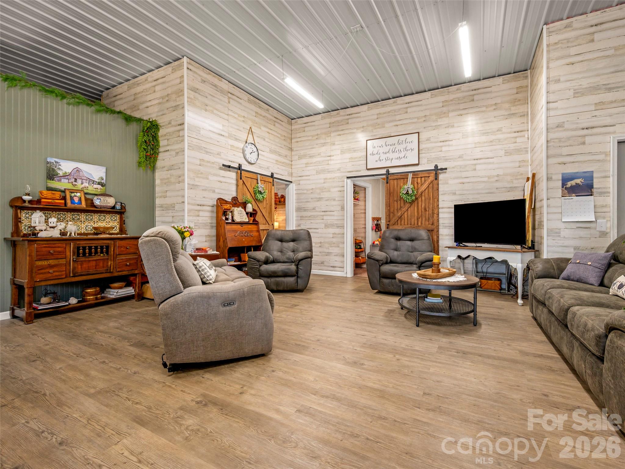 873 Ellenboro Henrietta Road Ellenboro, NC 28040 - Photo 12 of 48 a living room with furniture and a flat screen tv