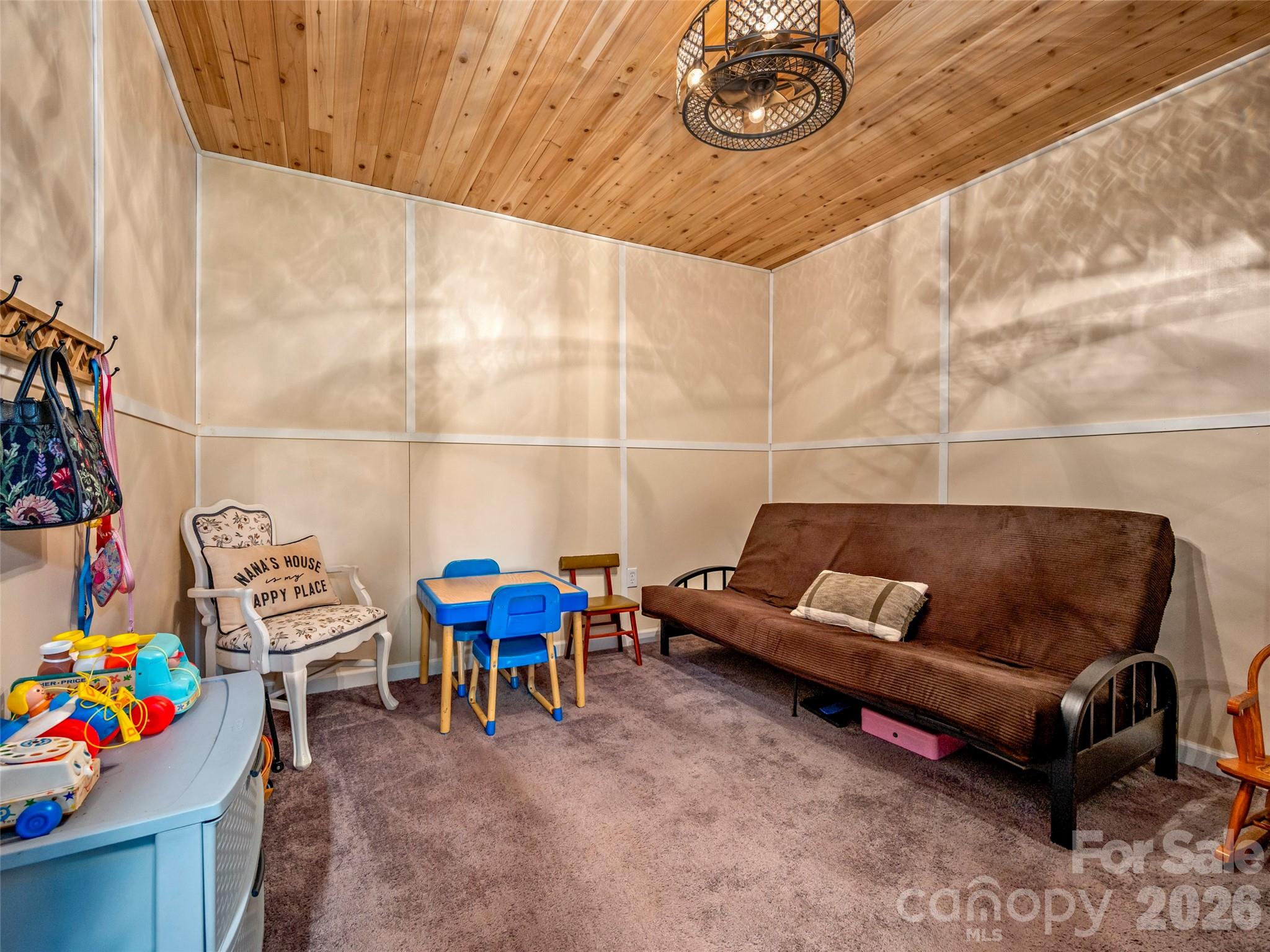 873 Ellenboro Henrietta Road Ellenboro, NC 28040 - Photo 13 of 48 a living room with furniture and a chair